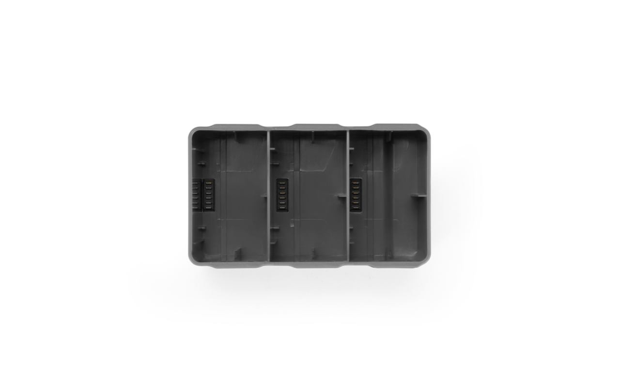 Auf dem Bild ist der DJI Mini 5 Pro Charging Hub (Ladehub) von oben zu sehen.
